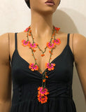 10.12.18 Orange and Fuschia Crochet beaded flower lariat necklace with Orange beads.