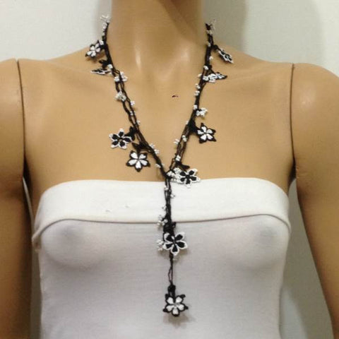 10.16.12 Black and White beaded flower lariat necklace with white beads.