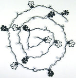 10.16.12 Black and White beaded flower lariat necklace with white beads.