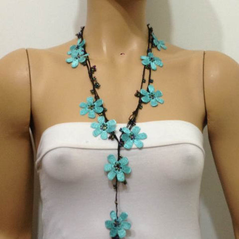 10.20.16 BLUE OYA Flower Lariat Necklace with black strand and purplish black beads.