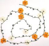 10.20.18 ORANGE and White OYA Flower Lariat Necklace with purplish black beads.