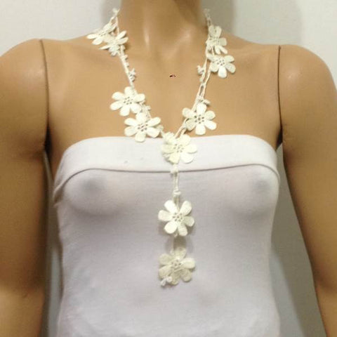 10.20.27 Off White OYA Flower Lariat Necklace with white beads.
